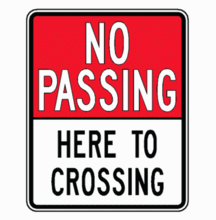 NO PASSING HERE TO CROSSING