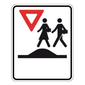 Passage pour écoliers sur un dos d'âne allongé ou un carrefour surélevé